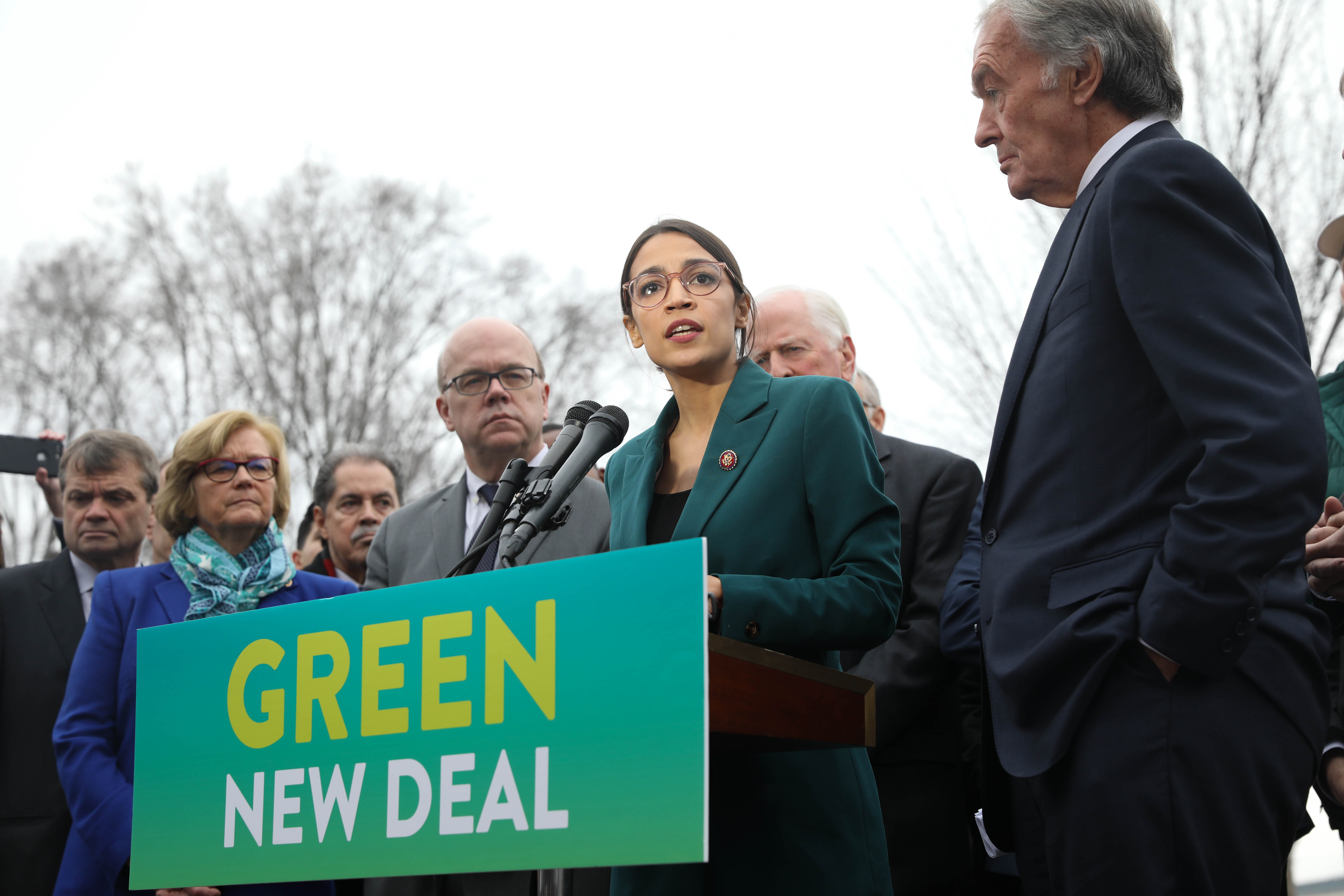 Alexandria Ocasio-Cortez speaking at a Green New Deal press event